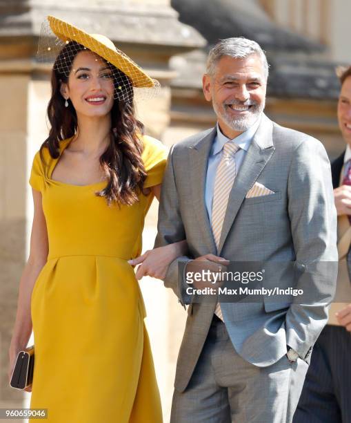 Amal Clooney and George Clooney attend the wedding of Prince Harry to Ms Meghan Markle at St George's Chapel, Windsor Castle on May 19, 2018 in...