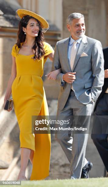 Amal Clooney and George Clooney attend the wedding of Prince Harry to Ms Meghan Markle at St George's Chapel, Windsor Castle on May 19, 2018 in...