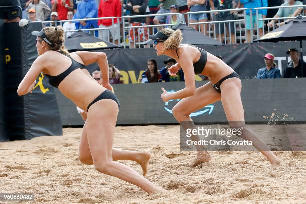 Alix Klineman and April Ross rush to the net during the women's finals at the 2018 AVP Austin Open at Krieg Fields on May 20, 2018 in Austin, Texas.