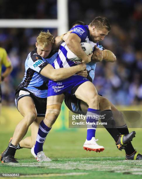 Kieran Foran of the Bulldogs is tackled during the round 11 NRL match between the Cronulla Sharks and the Canterbury Bulldogs at Southern Cross Group...