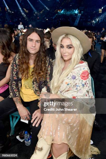 Recording artist Kesha and Brad Ashenfelter attend the 2018 Billboard Music Awards at MGM Grand Garden Arena on May 20, 2018 in Las Vegas, Nevada.