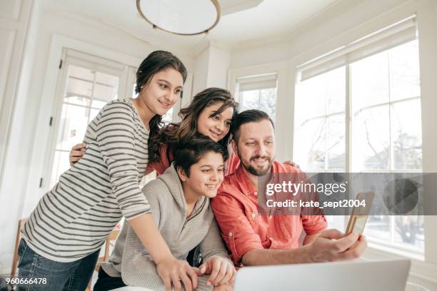 looking for insurance options online - greek ethnicity stock pictures, royalty-free photos & images