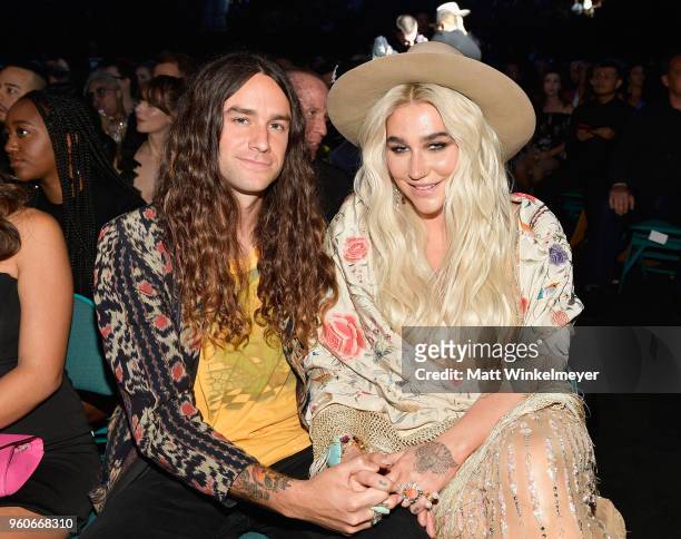 Recording artist Kesha and Brad Ashenfelter attend the 2018 Billboard Music Awards at MGM Grand Garden Arena on May 20, 2018 in Las Vegas, Nevada.