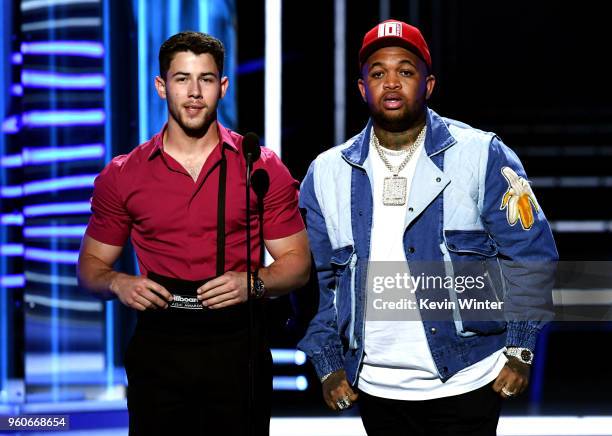 Recording artists Nick Jonas and DJ Mustard speak onstage during the 2018 Billboard Music Awards at MGM Grand Garden Arena on May 20, 2018 in Las...