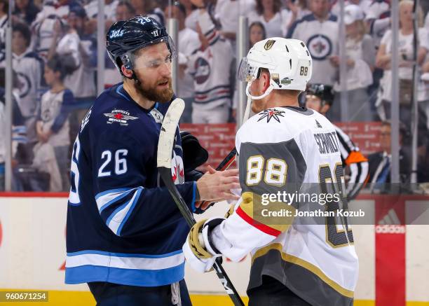 Blake Wheeler of the Winnipeg Jets shakes hands with Nate Schmidt of the Vegas Golden Knights following a 2-1 Knights victory in Game Five of the...