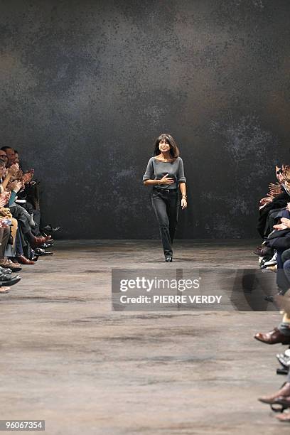 Veronique Nichanian, designer for Hermes, salutes at the end of her Men ready-to-wear Autumn-Winter 2010-2011 fashion shows in Paris, on January 23,...