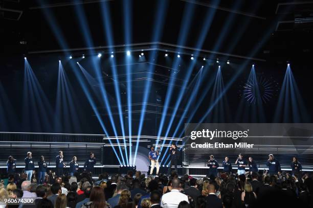 Recording artists Khalid and Shawn Mendes perform onstage with the Marjory Stoneman Douglas Student Choir during the 2018 Billboard Music Awards at...