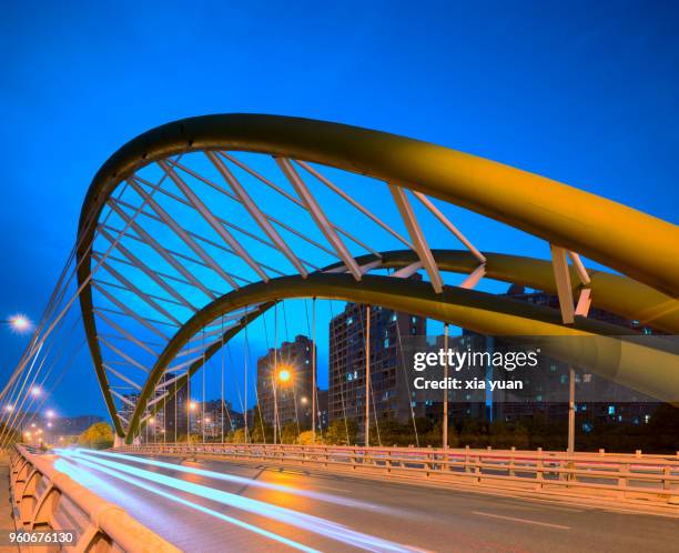 modern bridge with light trails in hangzhou,china - wire rope stock pictures, royalty-free photos & images