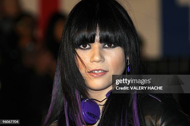 French singer Jena Lee poses upon her arrival at the Palais des Festivals in Cannes, southern France, on January 23 to attend French radio station...