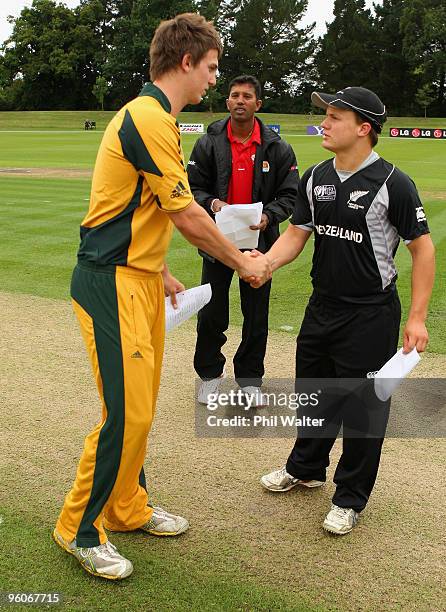 Mitchell Marsh of Australia and Craig Cachopa of New Zealand shake hands before the start of the ICC U19 Cricket World Cup quarter final three match...