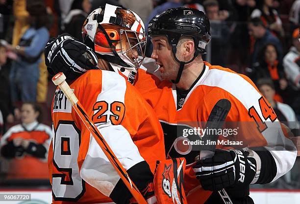Ray Emery and Ian Laperriere of the Philadelphia Flyers celebrate after defeating the Carolina Hurricanes on January 23, 2010 at Wachovia Center in...