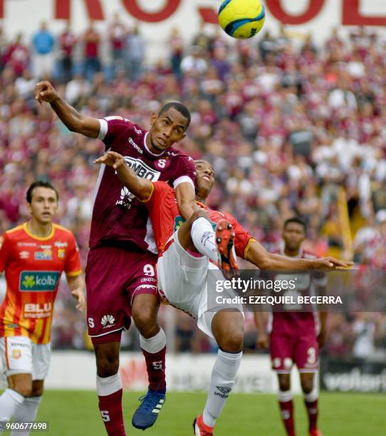 Deportivo Saprissa player Jerry Bengtson vies for the ball with Junior Diaz of Club Sport Herediano during the final of the Costa Rica Soccer...