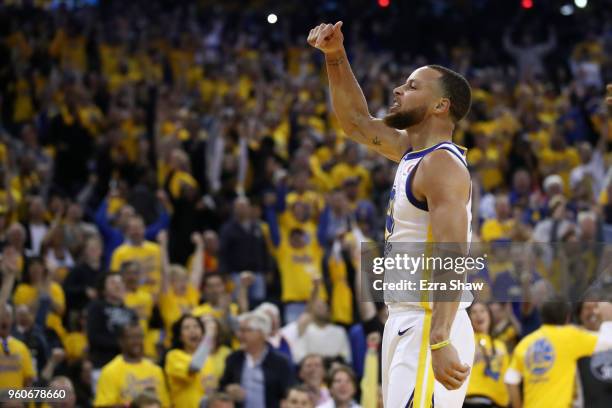 Stephen Curry of the Golden State Warriors reacts after a play against the Houston Rockets during Game Three of the Western Conference Finals of the...