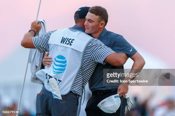 Aaron Wise hugs his caddie after winning the 50th annual AT&T Byron Nelson on May 20, 2018 at Trinity Forest Golf Club in Dallas, TX.