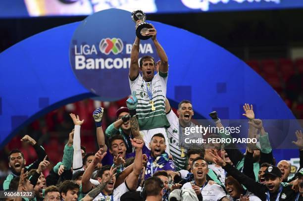 Santos players hold their trophy following their victory over Toluca in the Mexican Clausura 2018 tournament final at the Nemesio Diez stadium in...