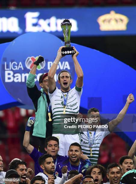 Santos players hold their trophy following their victory over Toluca in the Mexican Clausura 2018 tournament final at the Nemesio Diez stadium in...