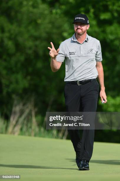 Jimmy Walker reacts after his birdie putt on the eighth green during the final round of the AT&T Byron Nelson at Trinity Forest Golf Club on May 20,...