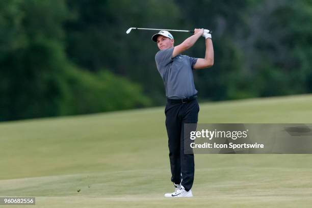 Aaron Wise hits his approach shot from the 18th fairway during the final round of the 50th annual AT&T Byron Nelson on May 20, 2018 at Trinity Forest...