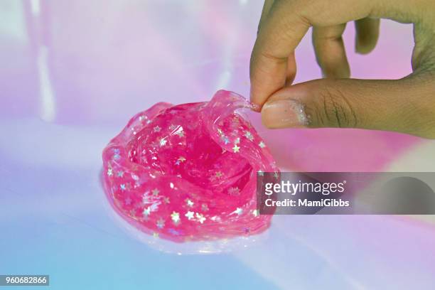 slime toy - mamigibbs stock pictures, royalty-free photos & images