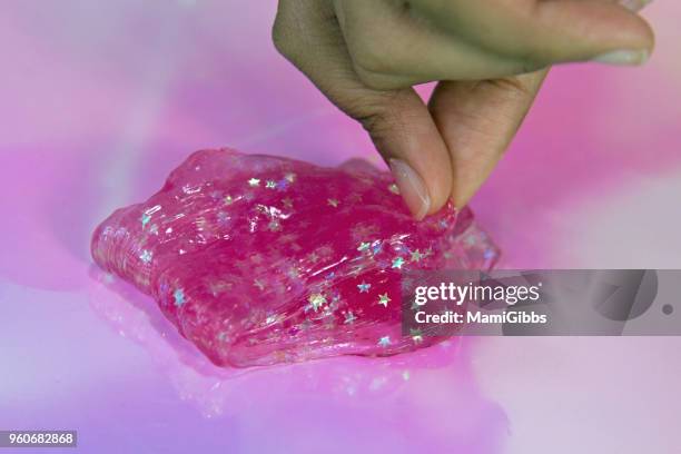 slime toy - mamigibbs stock pictures, royalty-free photos & images