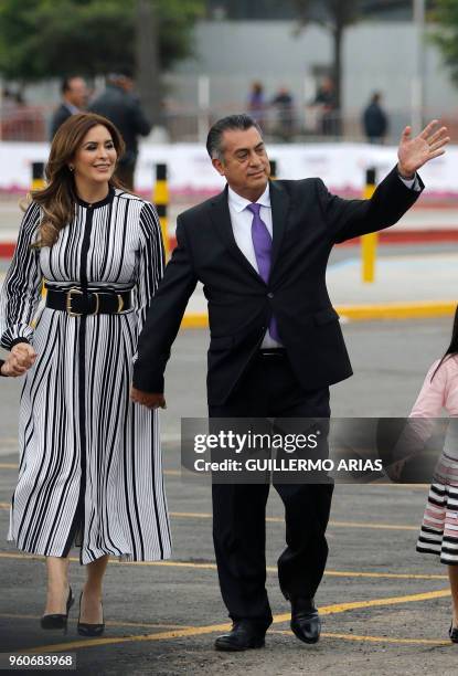 Mexico's Independent presidential candidate Jaime "el Bronco" Rodriguez Calderon waves next to his wife Adeline Avalos upon arrival at the...