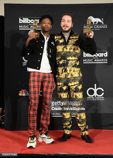 Recording artists 21 Savage and Post Malone, winners of the Top Rap Song award for 'Rockstar,' pose in the press room during the 2018 Billboard Music...