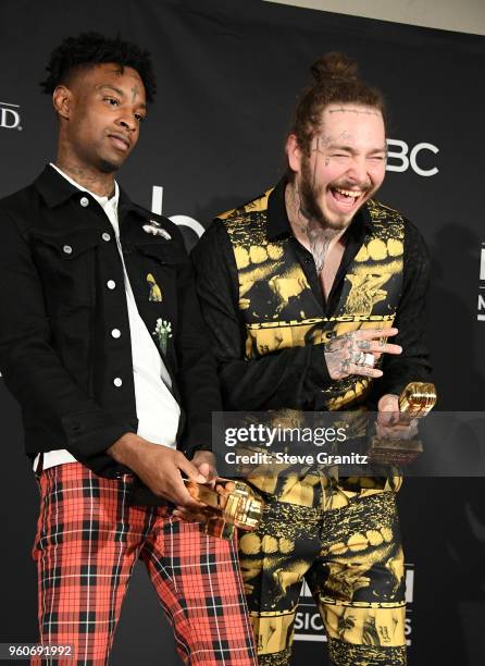 Recording artists 21 Savage and Post Malone, winners of the Top Rap Song award for 'Rockstar,' pose in the press room during the 2018 Billboard Music...