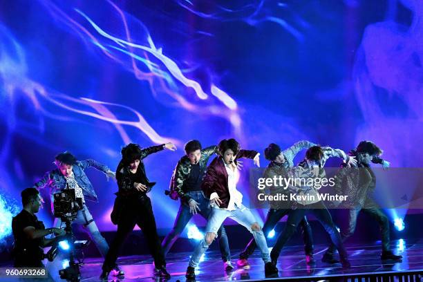 Music group BTS performs onstage during the 2018 Billboard Music Awards at MGM Grand Garden Arena on May 20, 2018 in Las Vegas, Nevada.