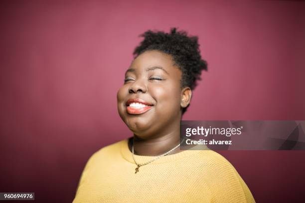 smiling young woman with eyes closed - formal portrait stock pictures, royalty-free photos & images