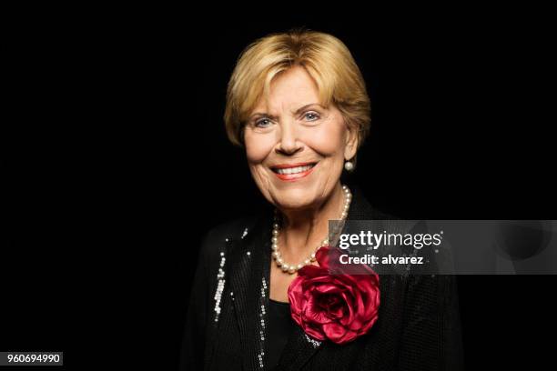 smiling senior woman with eyes closed - evening wear stock pictures, royalty-free photos & images