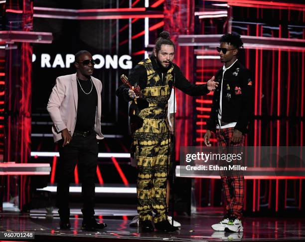 Post Malone and 21 Savage accept an award onstage during the 2018 Billboard Music Awards at MGM Grand Garden Arena on May 20, 2018 in Las Vegas,...