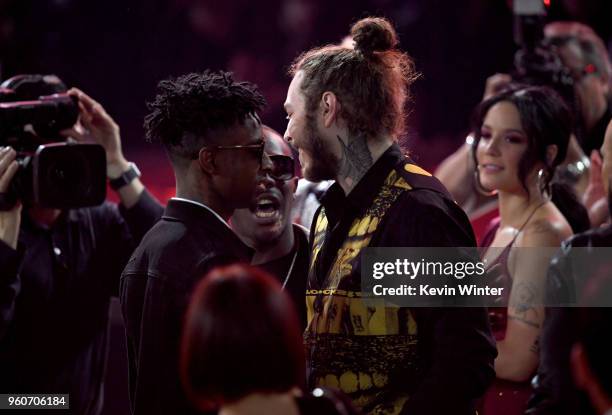 Recording artists 21 Savage and Post Malone attend the 2018 Billboard Music Awards at MGM Grand Garden Arena on May 20, 2018 in Las Vegas, Nevada.