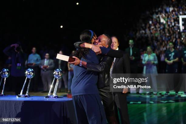 Maya Moore of the Minnesota Lynx hugs WNBA President Lisa Borders as she receives her 2017 WNBA Championship ring before the season-opening game...