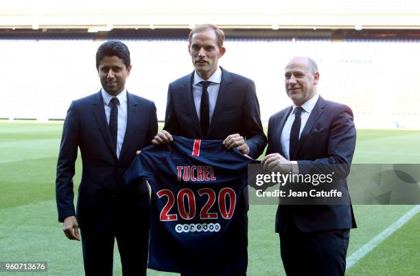 Thomas Tuchel of Germany is presented by President of PSG Nasser Al Khelaifi and Sporting Director of PSG Antero Henrique as new coach of Paris...