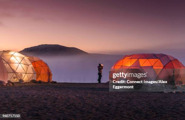 lit up dome tents, narsaq, vestgronland, greenland - arctic exploration stock pictures, royalty-free photos & images