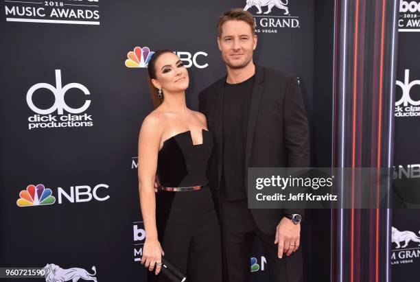 Actor Justin Hartley and Chrishell Stause attend the 2018 Billboard Music Awards at MGM Grand Garden Arena on May 20, 2018 in Las Vegas, Nevada.