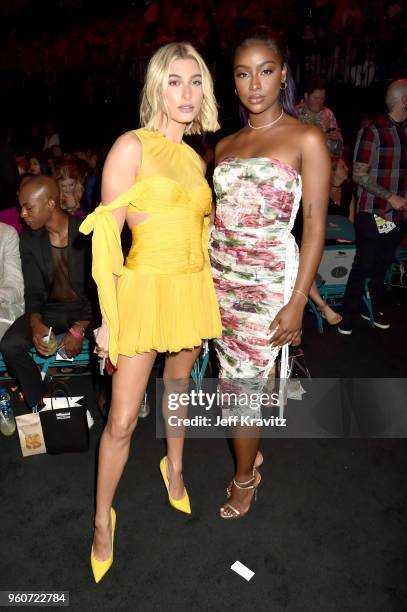 Hailey Baldwin and Justine Skye attend the 2018 Billboard Music Awards at MGM Grand Garden Arena on May 20, 2018 in Las Vegas, Nevada.