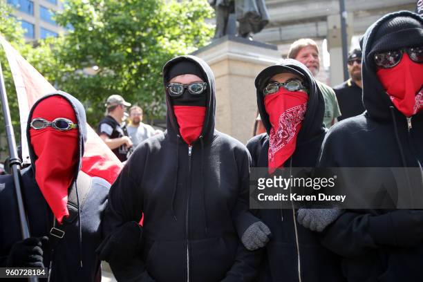 Counterprotestors attend an open carry and gun rights rally on May 20, 2018 in Seattle, Washington. The rally was led by Joey Gibson, leader of the...