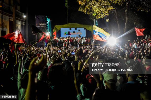 Venezuelan President Nicolas Maduro addresses supporters after the National Electoral Council announced the results of the voting on election day in...