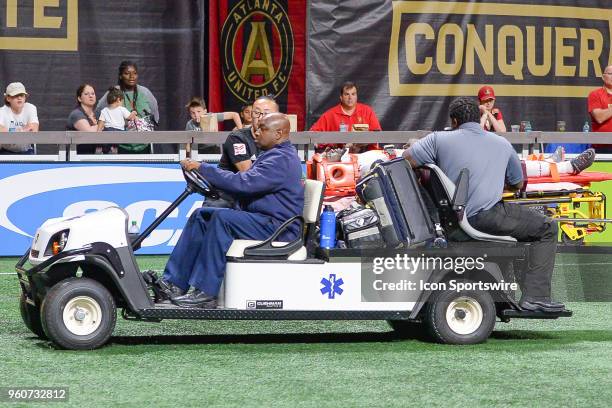 New York's Kemar Lawrence is carried off the pitch after sustaining an injury during the match between Atlanta United and New York Red Bulls on May...