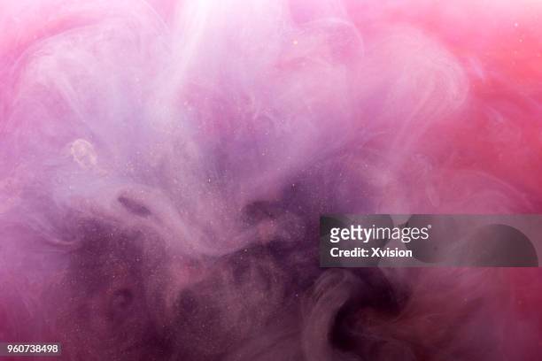color mixture in the water - viola colore foto e immagini stock