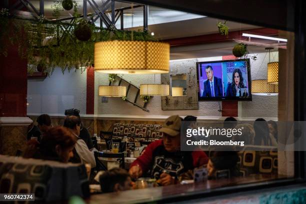 Television screen shows a broadcast of Jaime Rodriguez Calderon, independent presidential candidate, left, during the second presidential debate,...