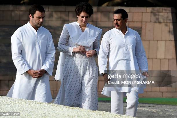 Indian Congress party president Rahul Gandhi , accompanied by his sister Priyanka Gandhi and her husband Robert Vadra, pay tribute to their late...