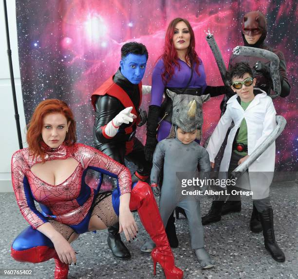 Actress Maitland Ward poses with Nightcrawler, Medusa, The Rhino, Daredevil and Doctor Octopus at Comic Con Revolution held at the Ontario Convention...