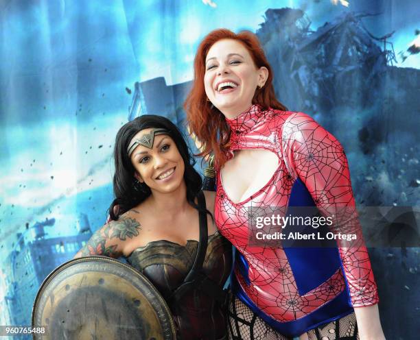 Actress Maitland Ward poses with Wonder Woman at Comic Con Revolution held at the Ontario Convention Center on May 20, 2018 in Ontario, California.