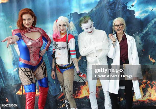 Actress Maitland Ward poses with The Joker, Harley Quinn and Dr. Harleen Frances Quinzel at Comic Con Revolution held at the Ontario Convention...