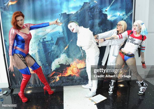 Actress Maitland Ward poses with The Joker, Harley Quinn and Dr. Harleen Frances Quinzel at Comic Con Revolution held at the Ontario Convention...