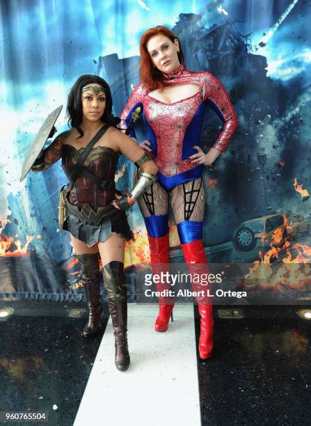 Actress Maitland Ward poses with Wonder Woman at Comic Con Revolution held at the Ontario Convention Center on May 20, 2018 in Ontario, California.
