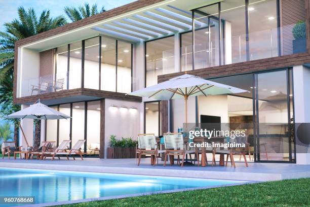 modern luxury house with swimming pool - holiday home decor stock pictures, royalty-free photos & images