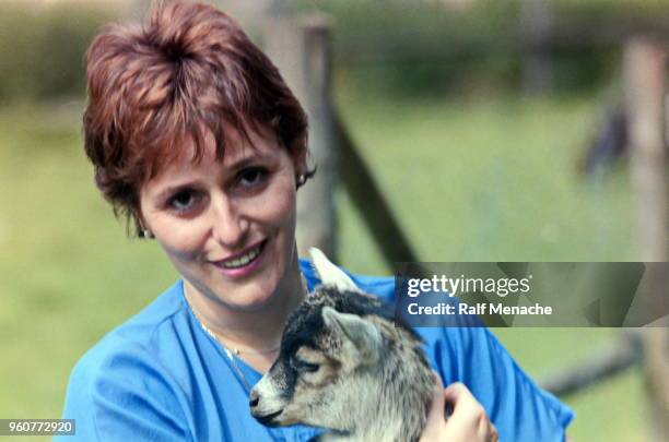 the eighties. the young woman and the baby goat. - 80s hair stock pictures, royalty-free photos & images